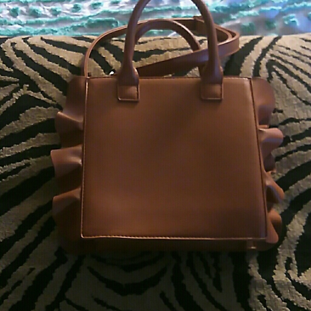Love raffle Honda side purse brown but it new